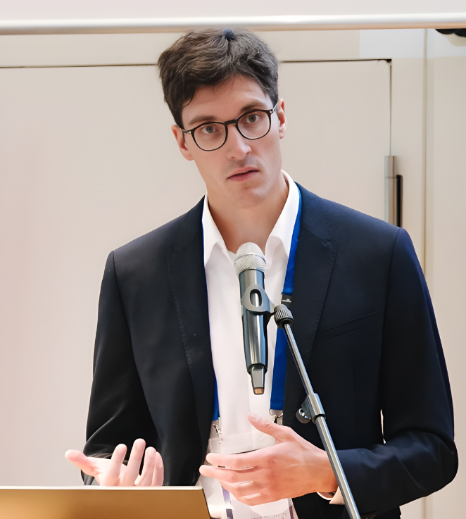 Dr. Timo Lenk at a conference